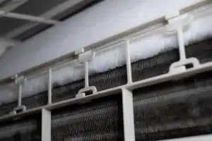 What’s the Difference Between Evaporator and Condenser Coils? 9 close up ice coil cooler dirty air conditioner 1