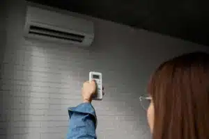 Is it Better Financially to Repair or Replace My AC? 5 young woman using home technology 1